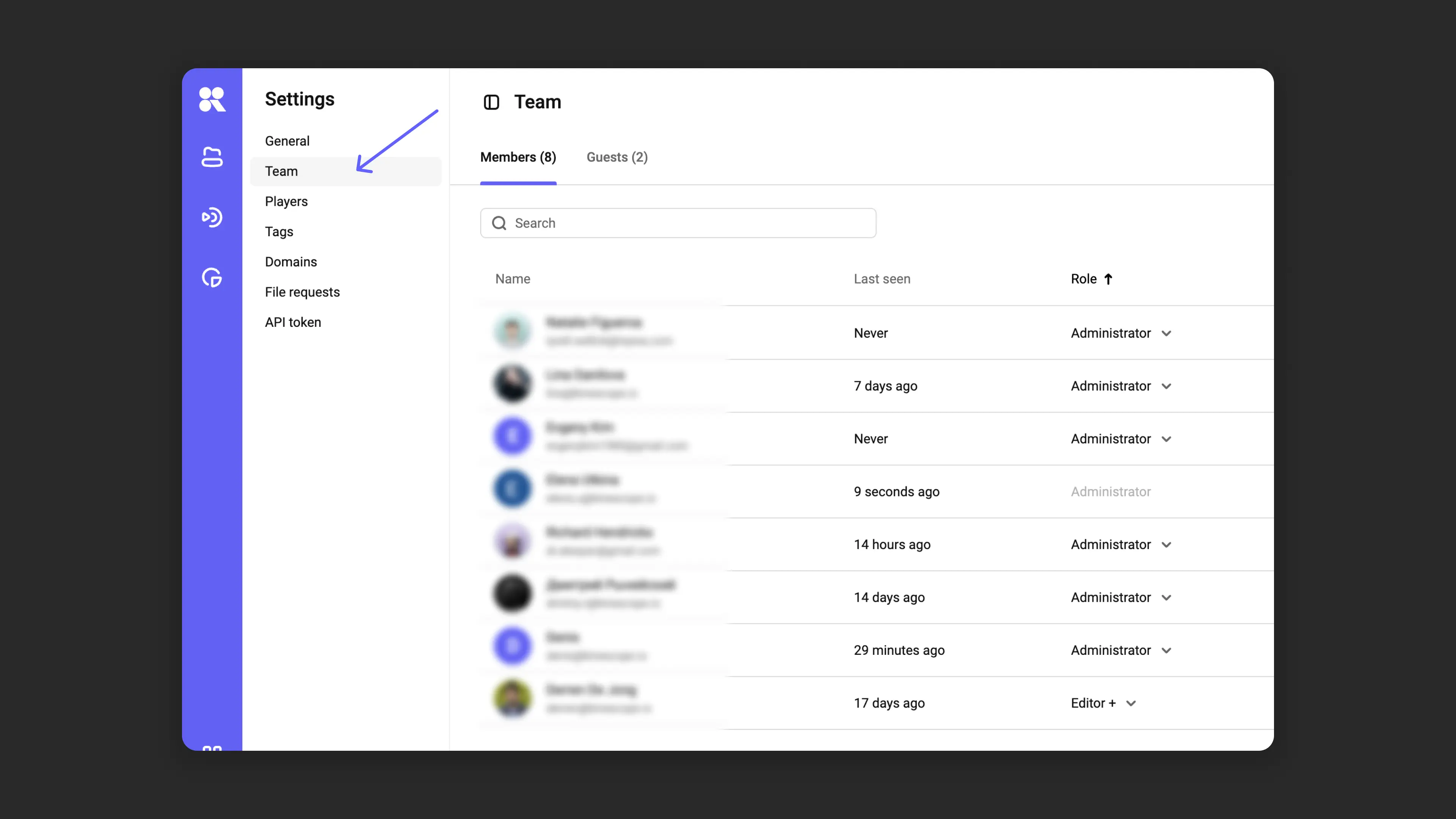Settings → Team page with workspace members and roles